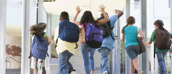 Children running into school